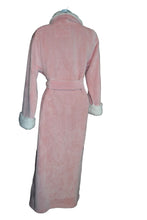 Load image into Gallery viewer, Pink robe with white trim on a hanger against a background of folded clothes.