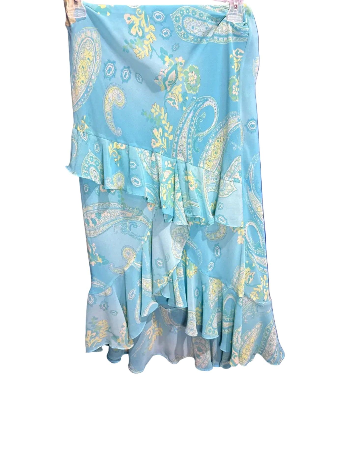 Stack of blue and yellow patterned face masks on a blue background