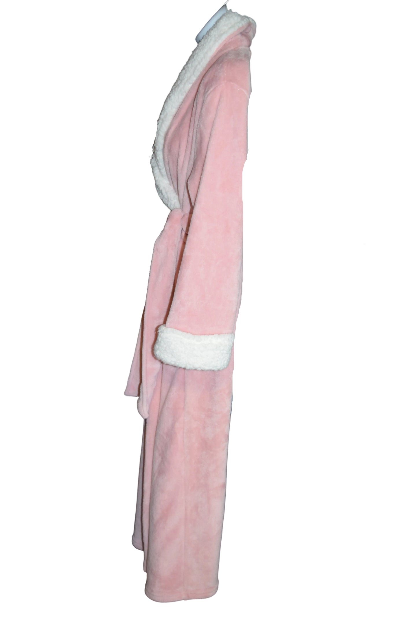 Stack of folded clothes on a metal rack with a neutral background