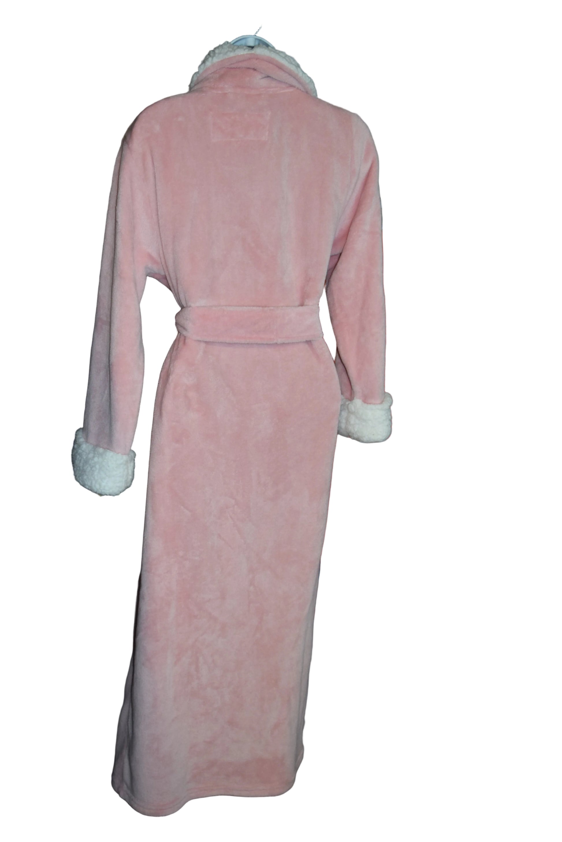 Pink robe with white trim on a hanger against a background of folded clothes.