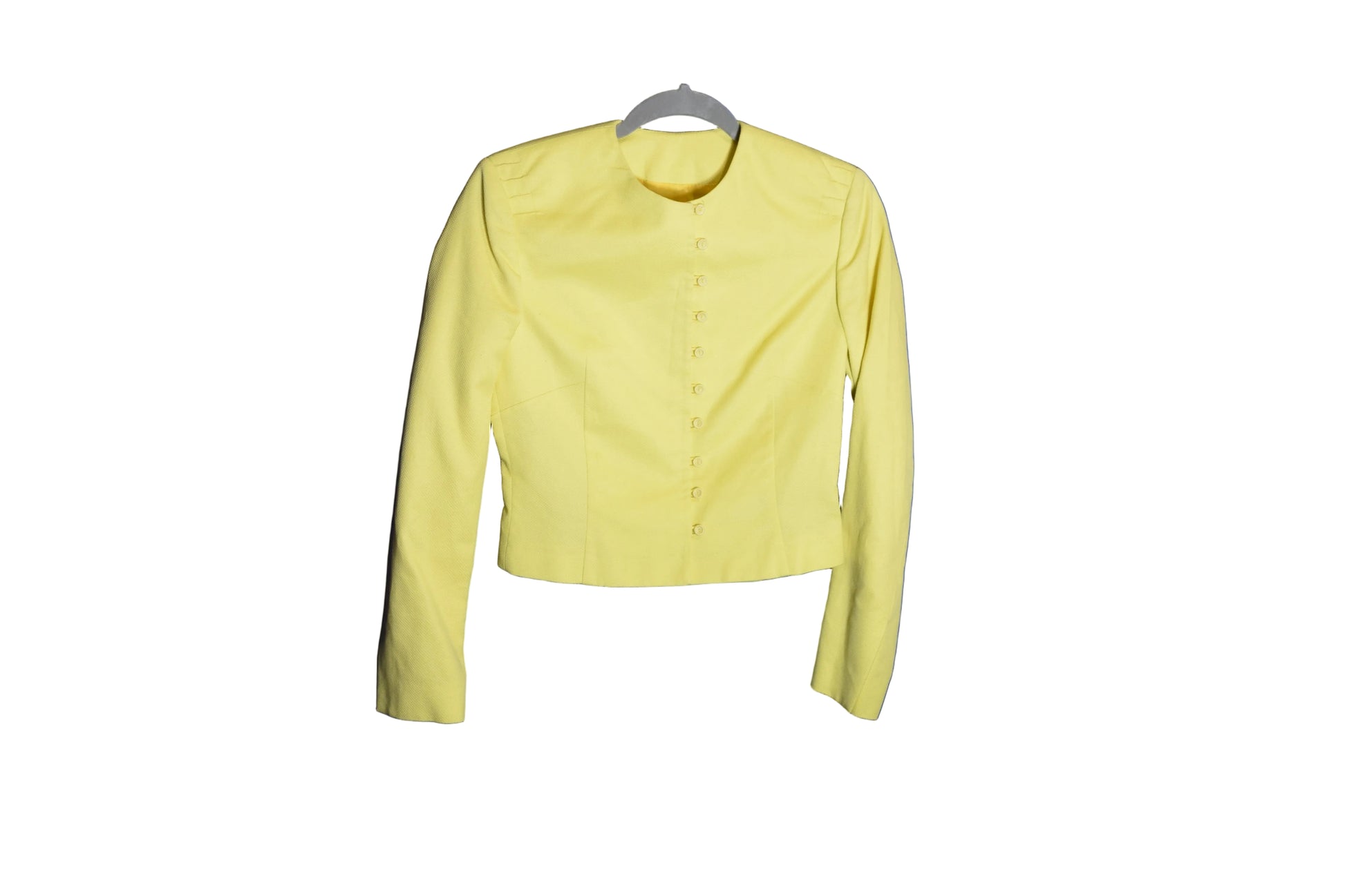 Decorative item with a brown leaf-like object on a blue background