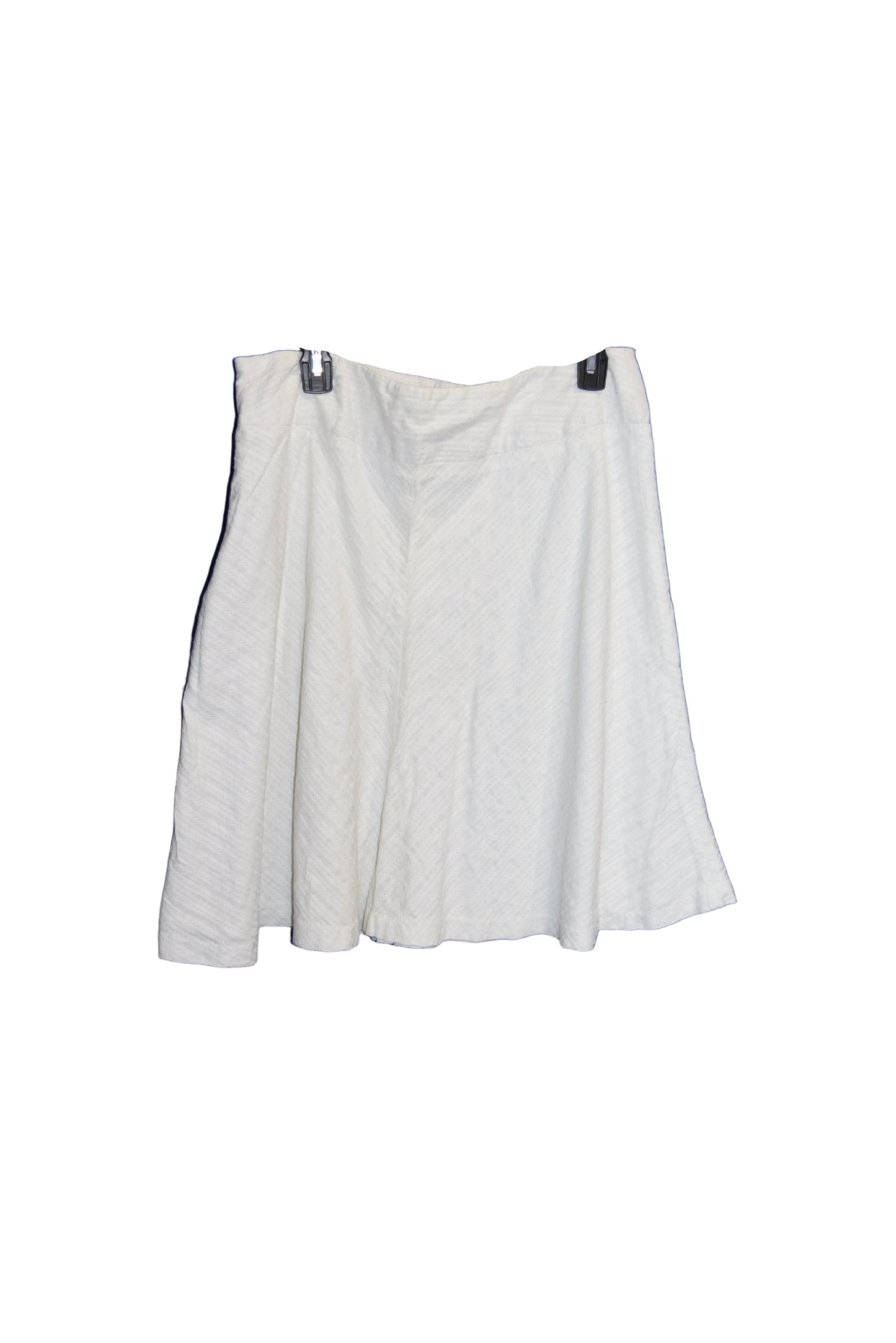 White shirt on a hanger against a blue background