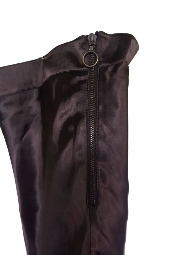 Brown jacket with a zipper on a mannequin against a white wall.