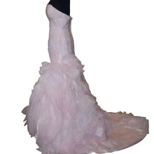 Load image into Gallery viewer, Pink wedding dress on a mannequin in a room with beige walls and wooden floor.
